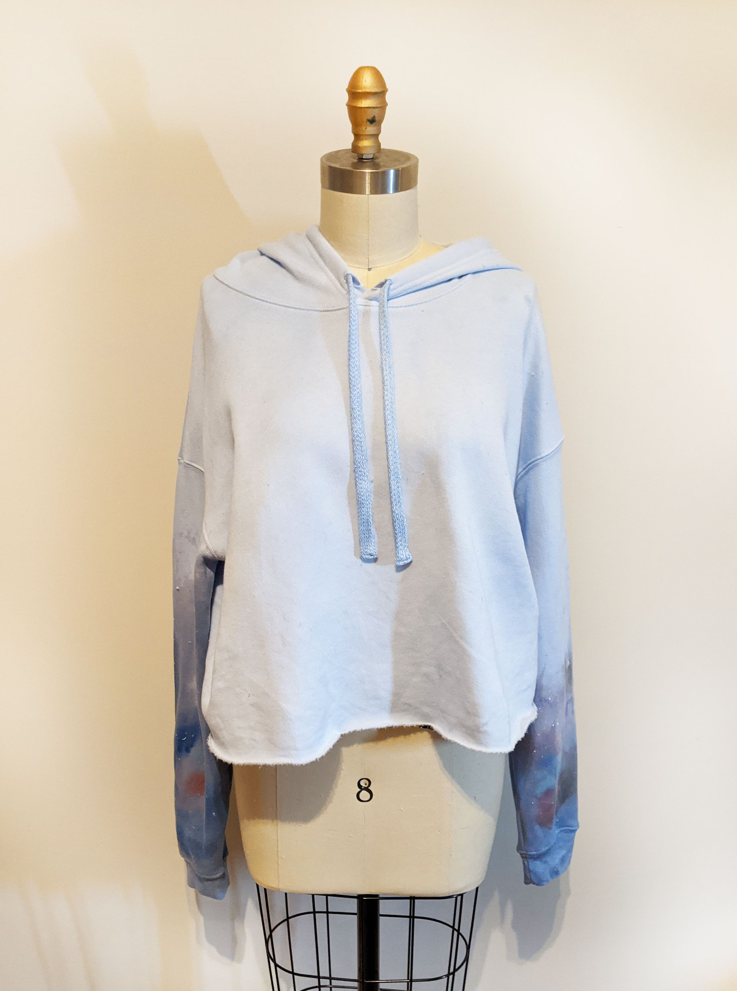 Let fashion and comfort take over your wardrobe with this great statement piece. The trendy raw hem is the perfect long-sleeve hooded shirt to bring you into the spring and summer.