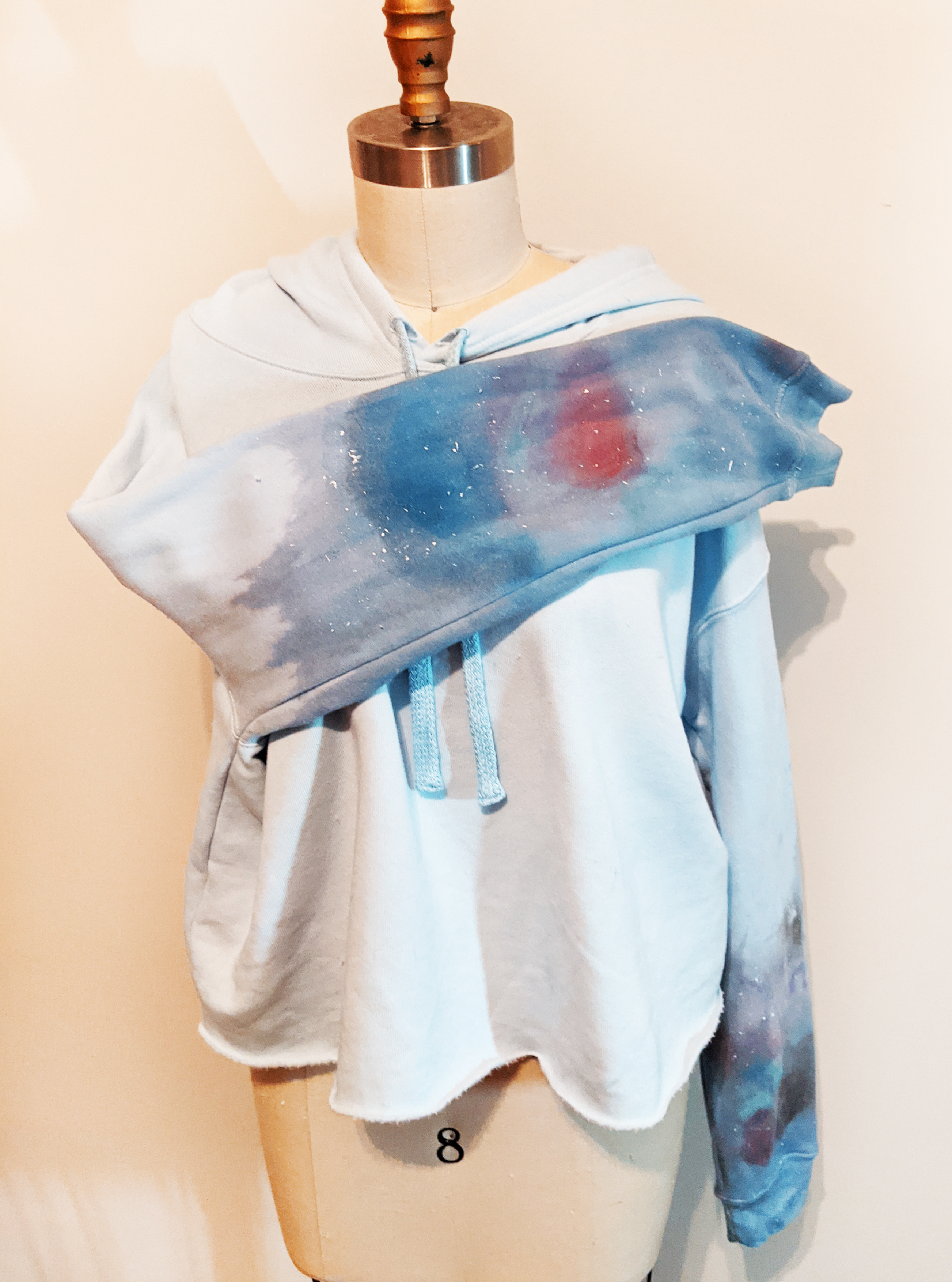 Let fashion and comfort take over your wardrobe with this great statement piece. The trendy raw hem is the perfect long-sleeve hooded shirt to bring you into the spring and summer.