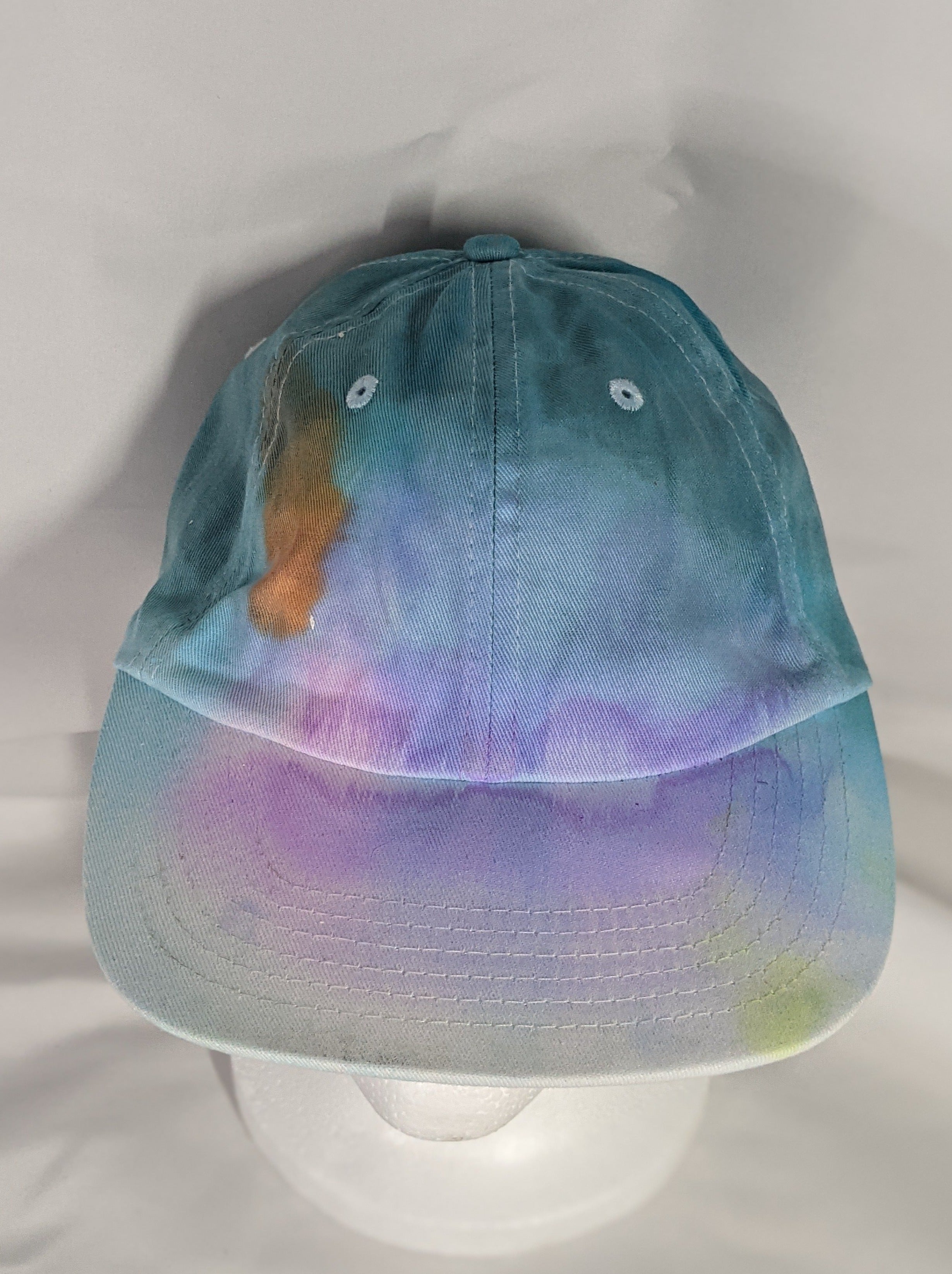 Add a splash of color to your wardrobe and your adventures. A fun nod to space, this abstract and tie-dye inspired updated take on the classic dad hat offers plenty of shade and loads of comfort no matter where you roam.