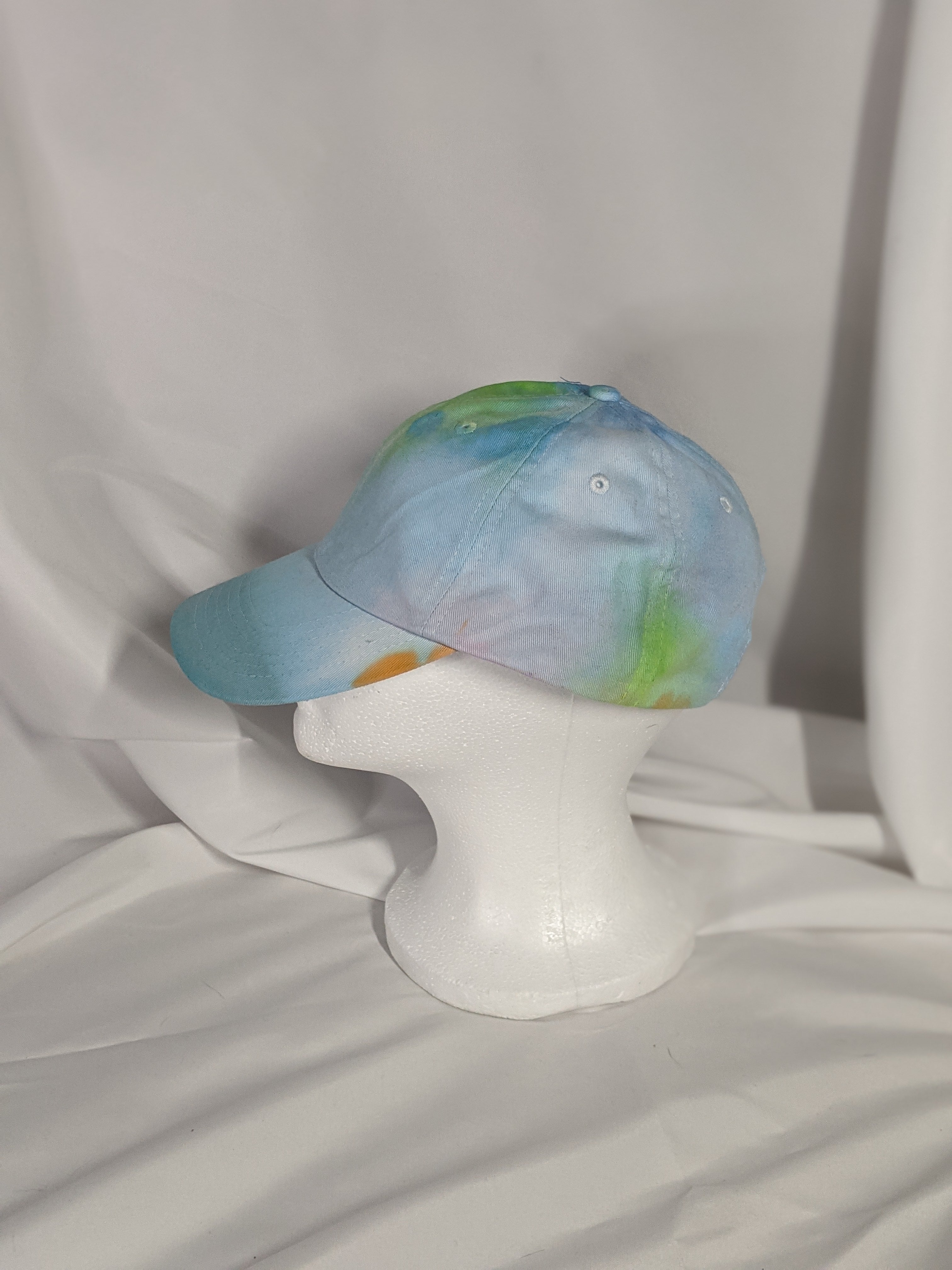 Add a splash of color to your wardrobe and your adventures. A fun nod to space, this abstract and tie-dye inspired updated take on the classic dad hat offers plenty of shade and loads of comfort no matter where you roam.