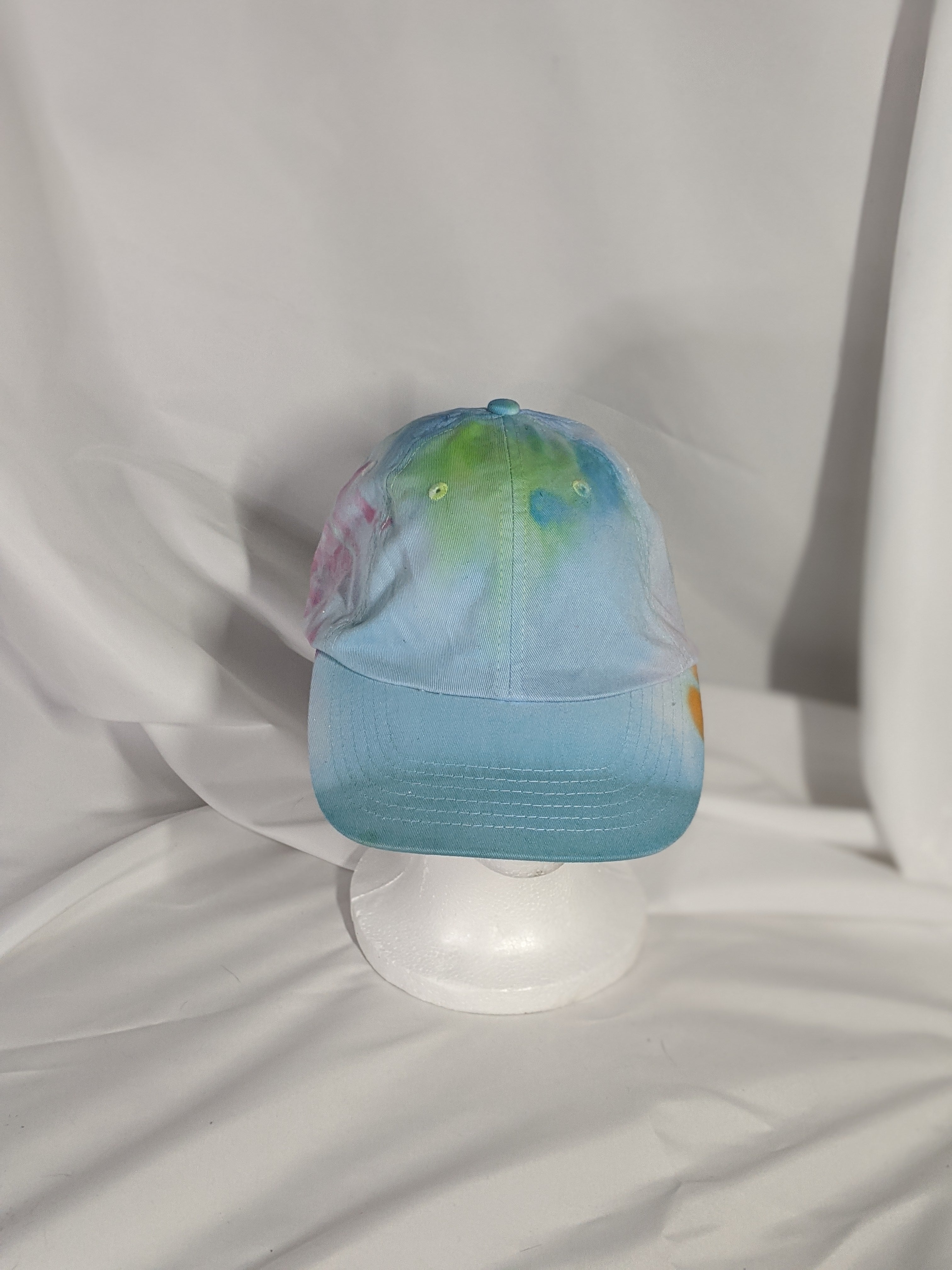 Add a splash of color to your wardrobe and your adventures. A fun nod to space, this abstract and tie-dye inspired updated take on the classic dad hat offers plenty of shade and loads of comfort no matter where you roam.