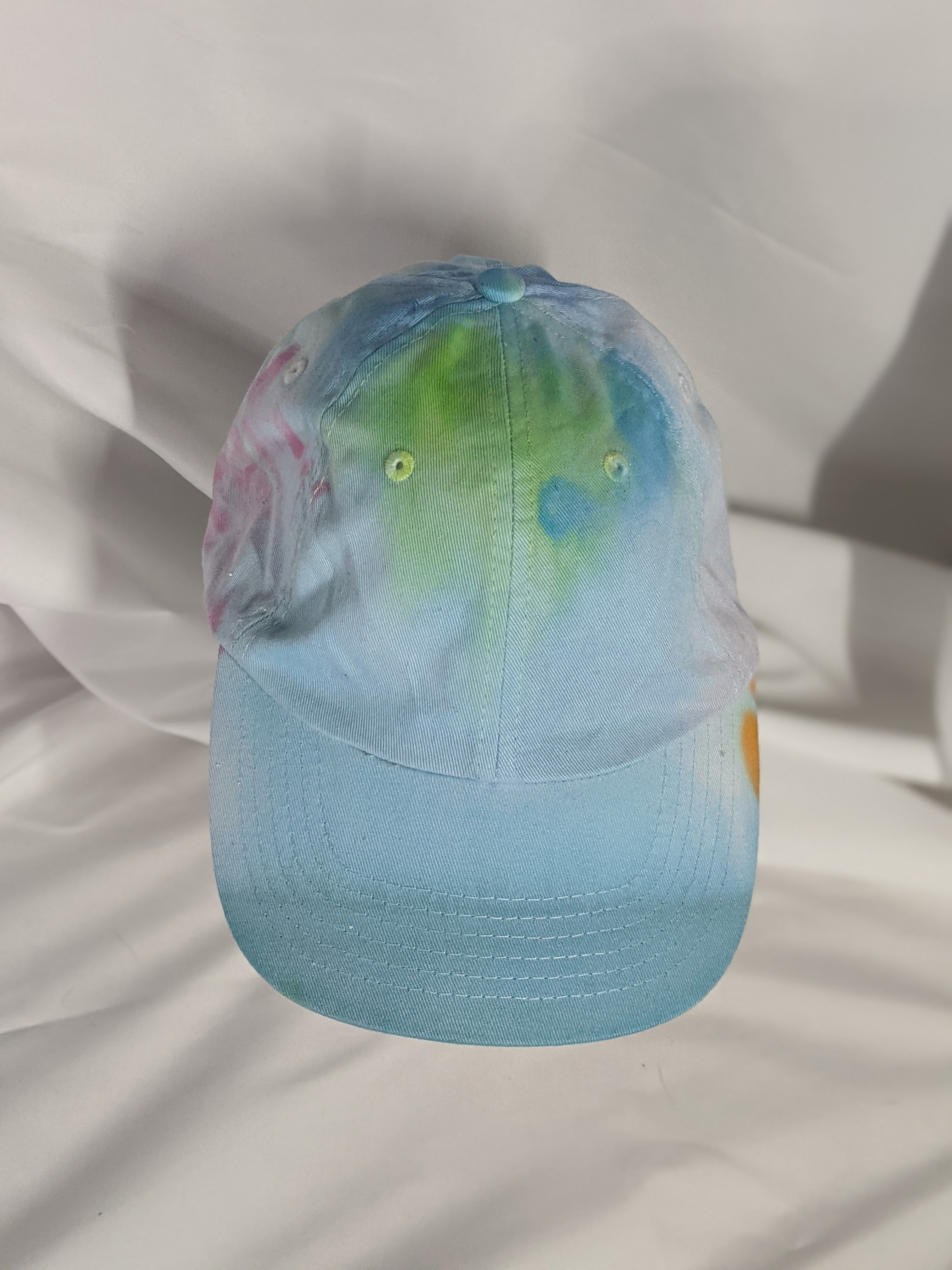 Add a splash of color to your wardrobe and your adventures. A fun nod to space, this abstract and tie-dye inspired updated take on the classic dad hat offers plenty of shade and loads of comfort no matter where you roam.