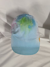 Load image into Gallery viewer, Add a splash of color to your wardrobe and your adventures. A fun nod to space, this abstract and tie-dye inspired updated take on the classic dad hat offers plenty of shade and loads of comfort no matter where you roam.
